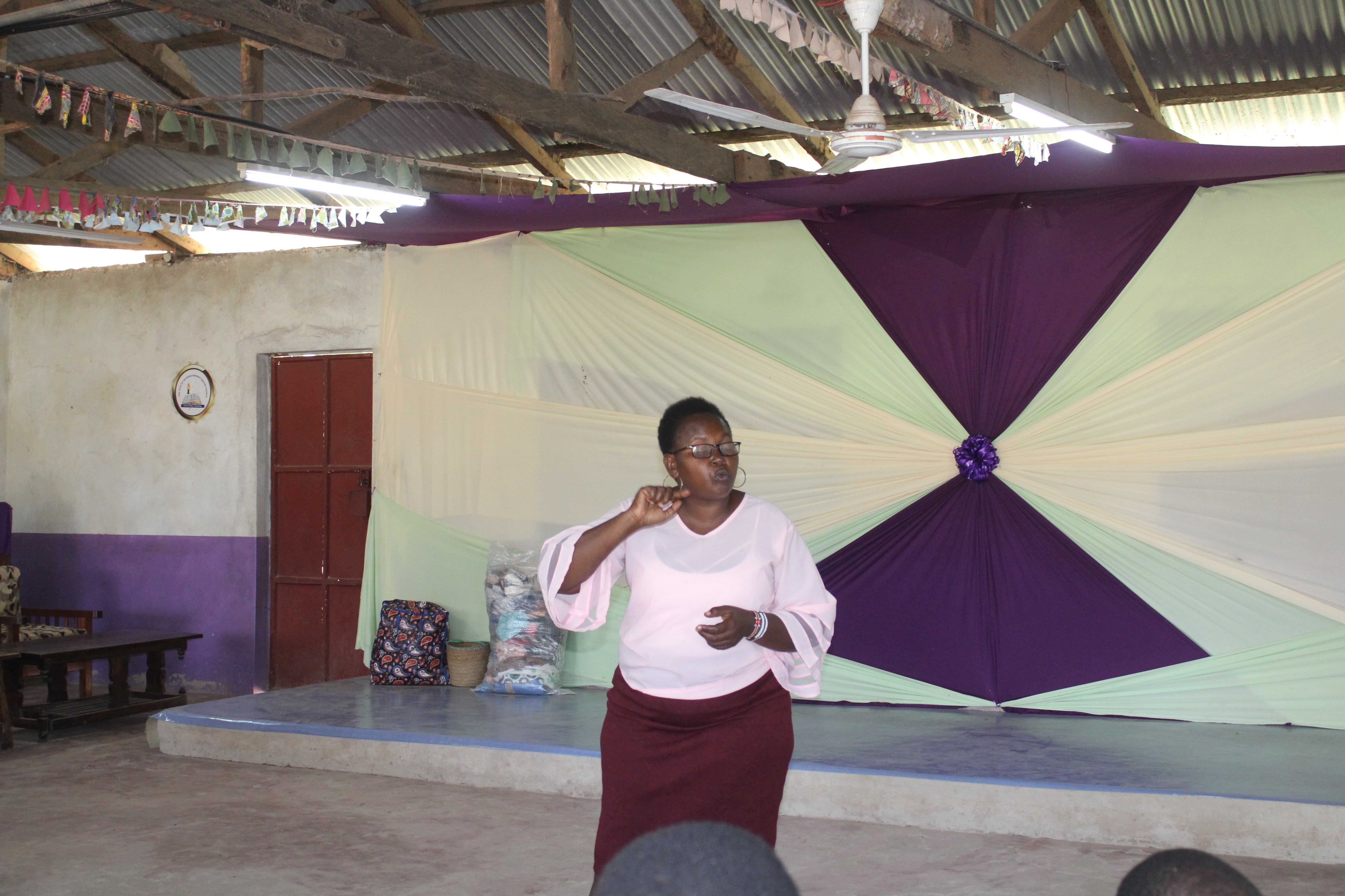 Hogla facilitating a townhall meeting in Kilifi