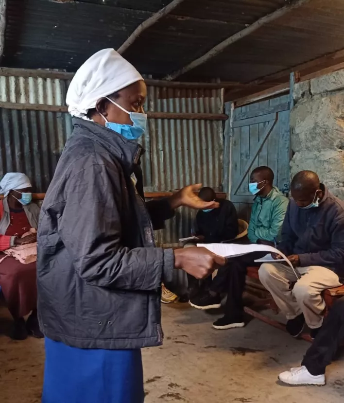 WHRD Toolkit Organiser addresses parents in a town hall meeting on child pregnancies